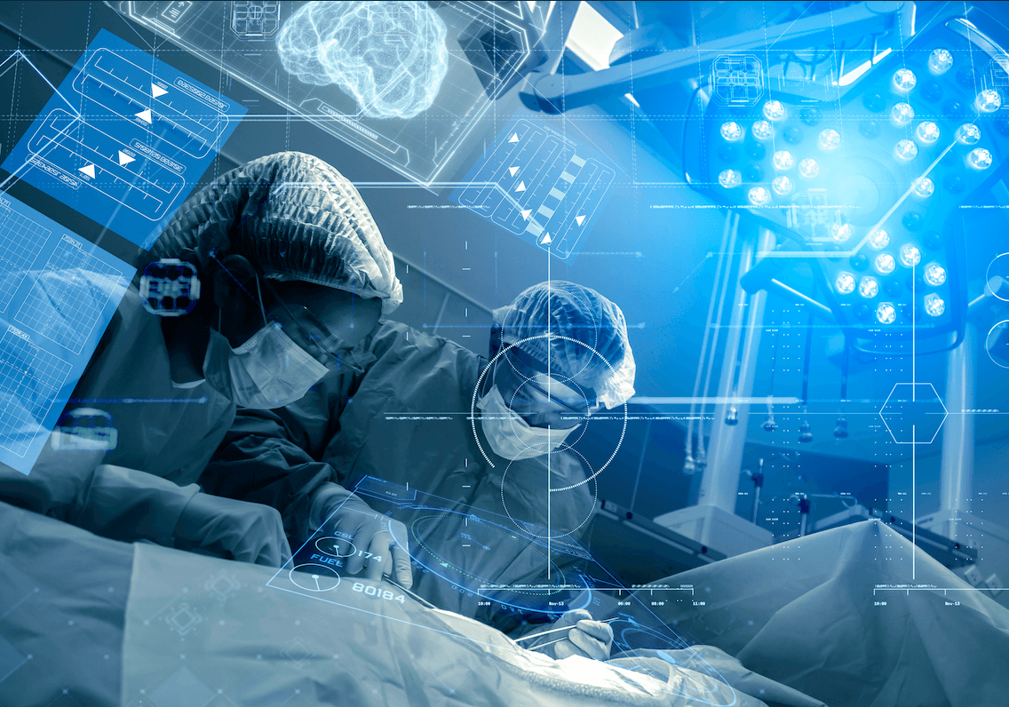 A female student is smiling as she looks down to her laptop, as she has her hands hovering slightly over its keyboard.